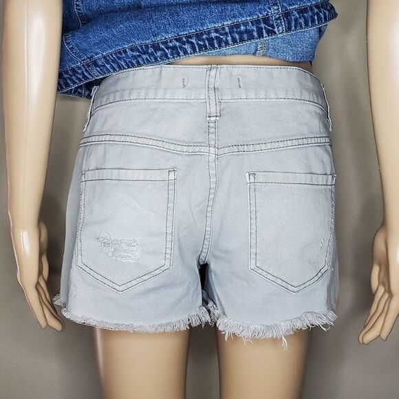 Free People Rugged Ripped Denim Shark Bite Shorts - Picture 10 of 13